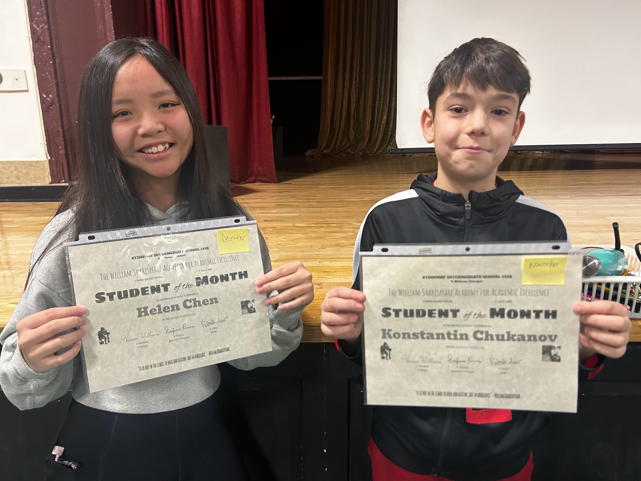 Helen Chen and Konstantin Chukanov holding Student of the Month certificates