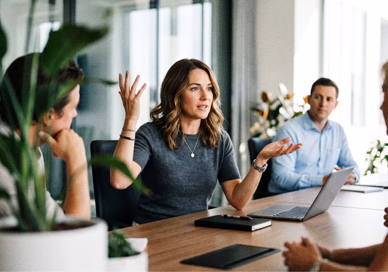 A woman making a point during a team meeting