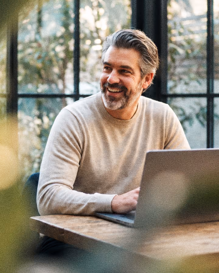 A man working on a laptop at his desk
