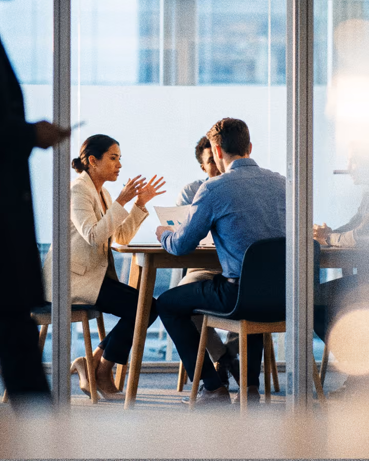A leadership team meeting around a conference table