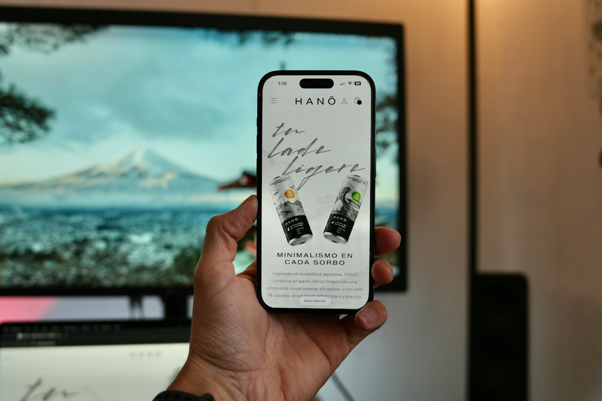 Hand holding a smartphone displaying an online store product page
