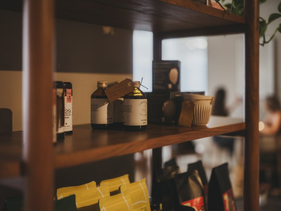 Labelled product bottles on a shelf, showing brand consistency in packaging