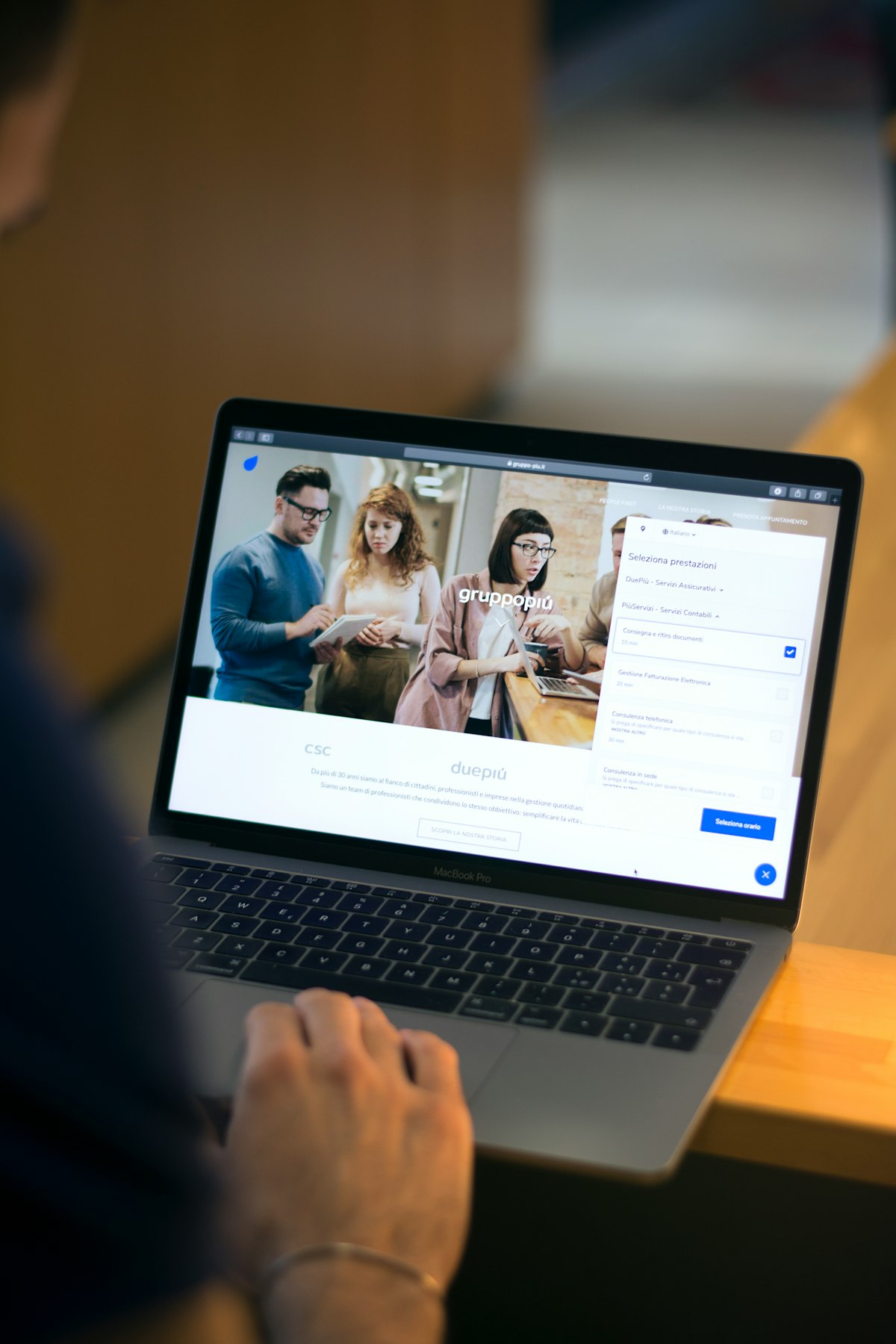 MacBook open on a desk, set up for reviewing marketing data