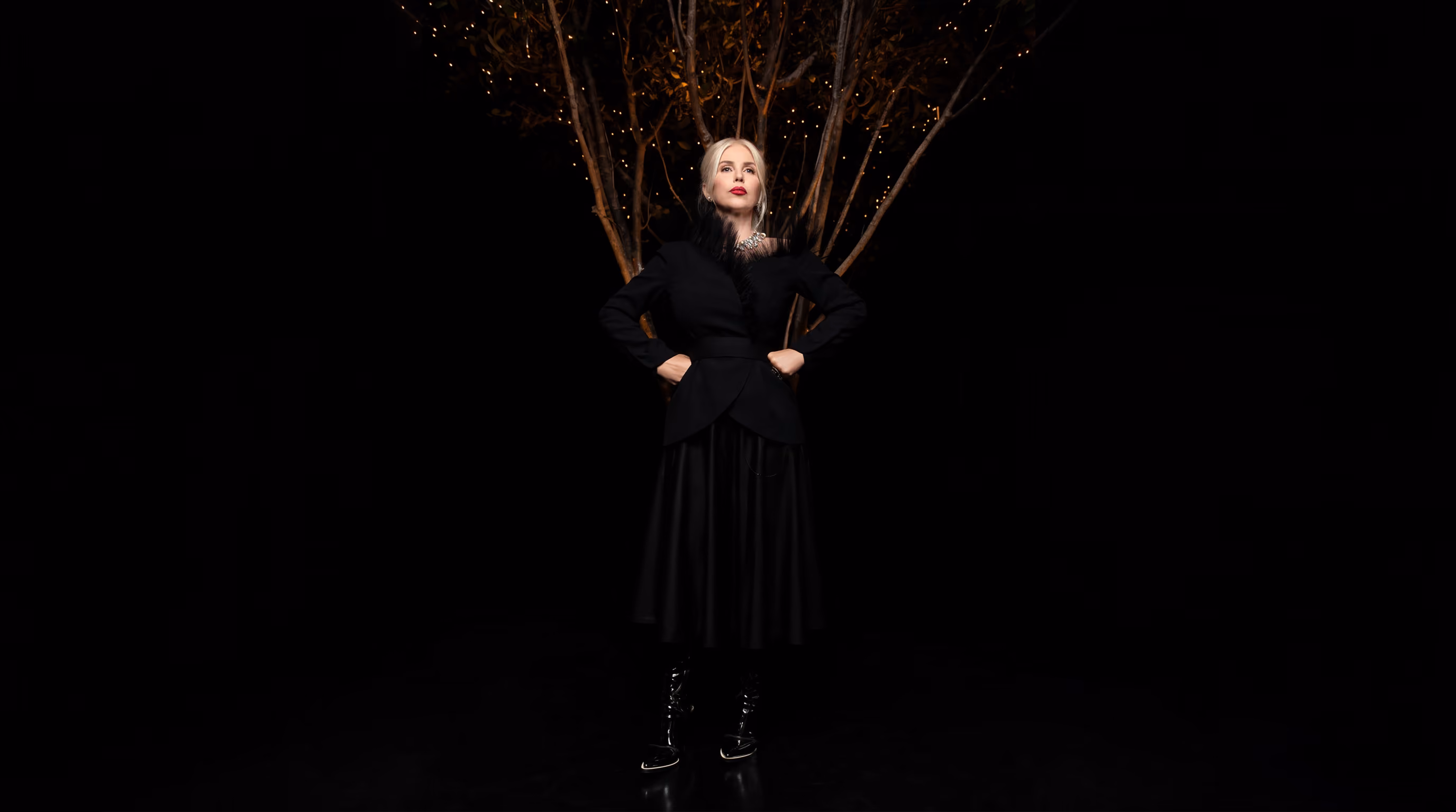Attorney Joumana Kayrouz outdoors in a feather coat