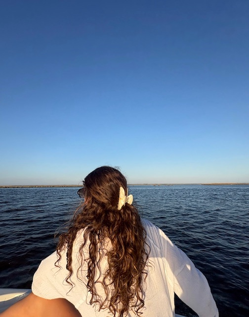 Lara on the water under an open sky