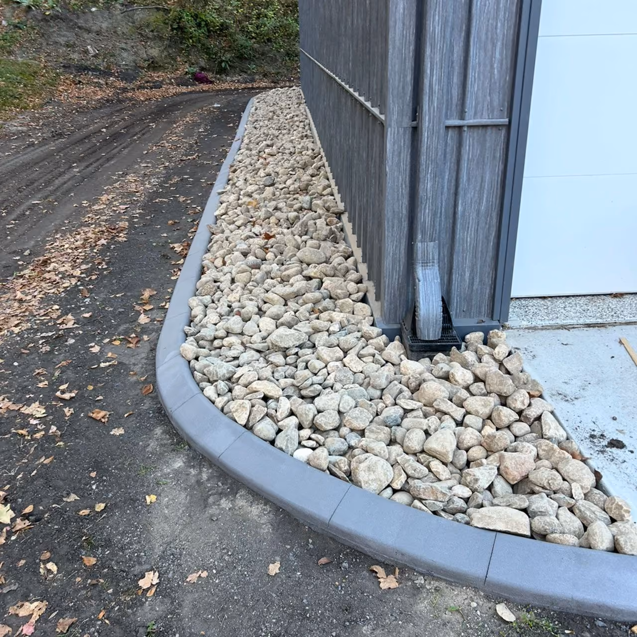 Decorative stone installation by Musolf Property Maintenance for clean, low maintenance landscape beds in Detroit Lakes Minnesota near me