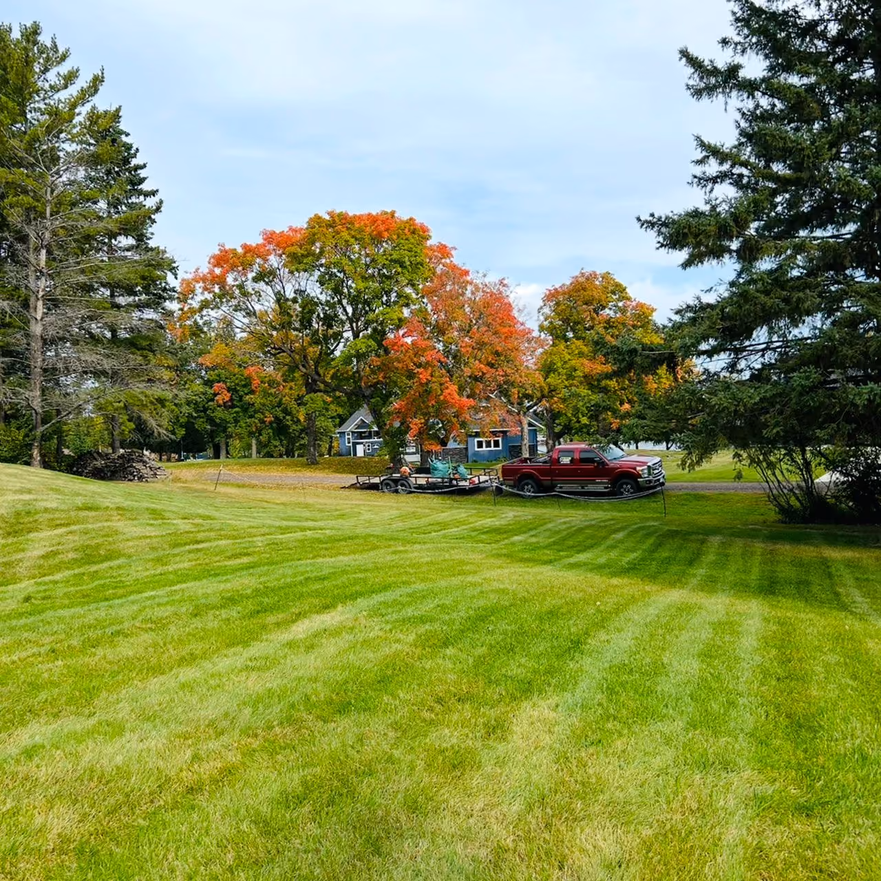 Freshly mowed lawn by Musolf Property Maintenance with clean stripes and a professional finish in Detroit Lakes Minnesota
