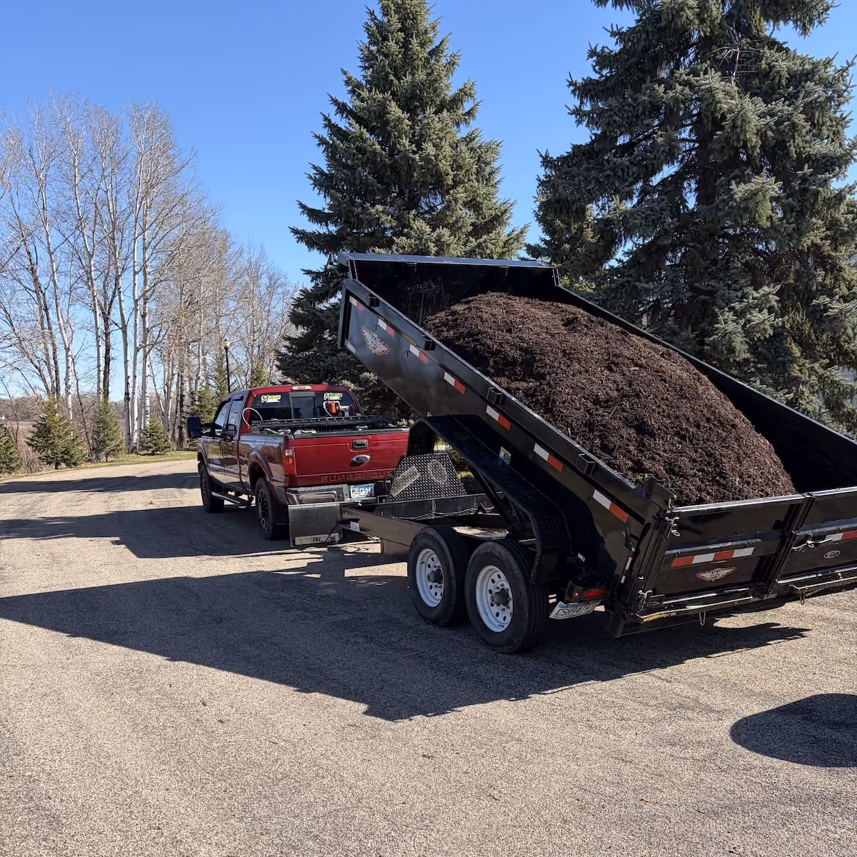 Mulch installation by Musolf Property Maintenance for clean, refreshed landscape beds in Detroit Lakes Minnesota near me