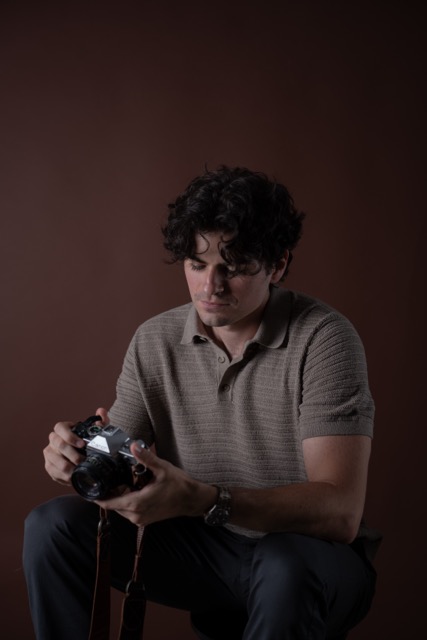 Leo Baralt with a film camera