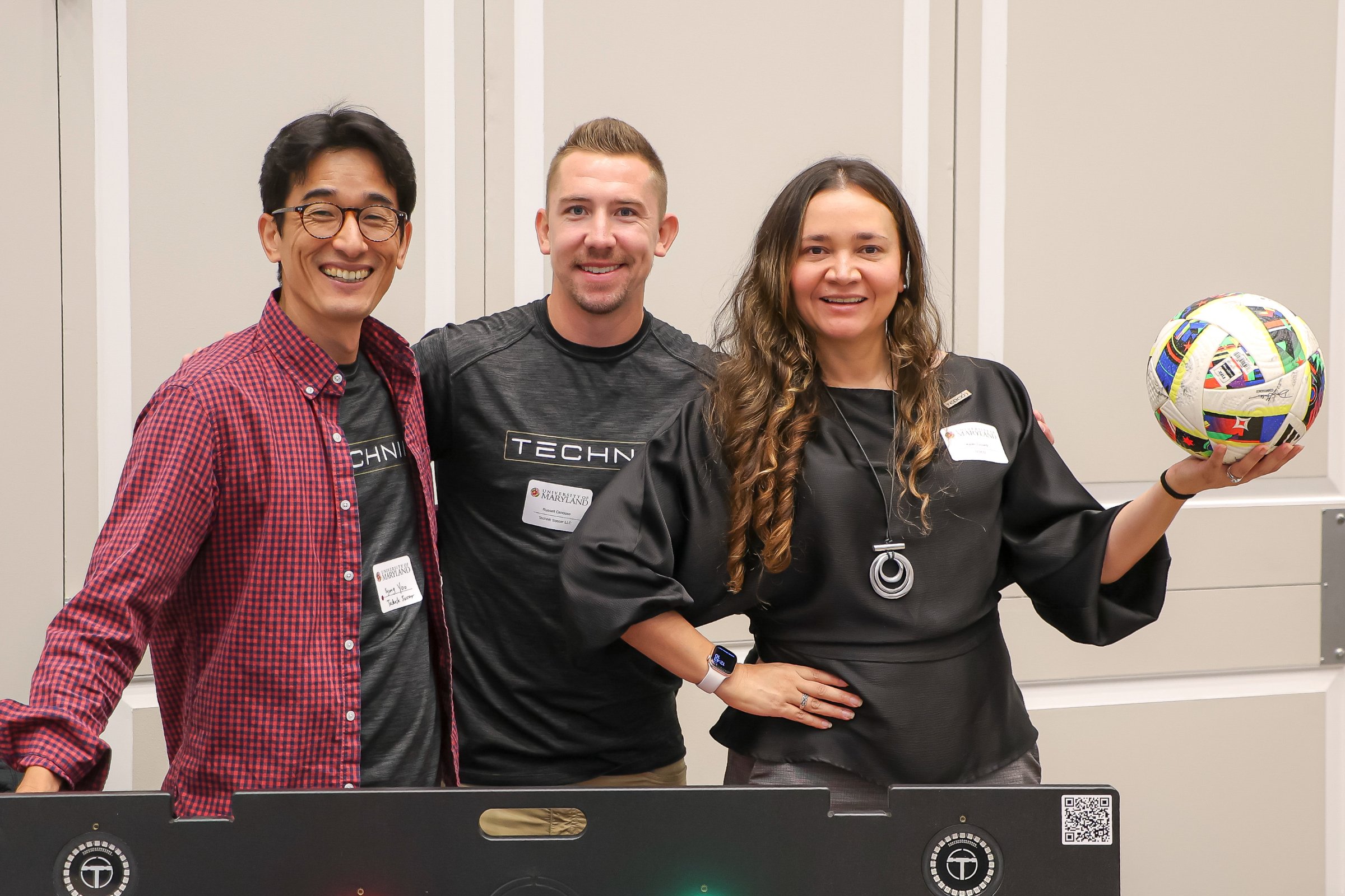 The Technik Soccer team at their exhibit hall table