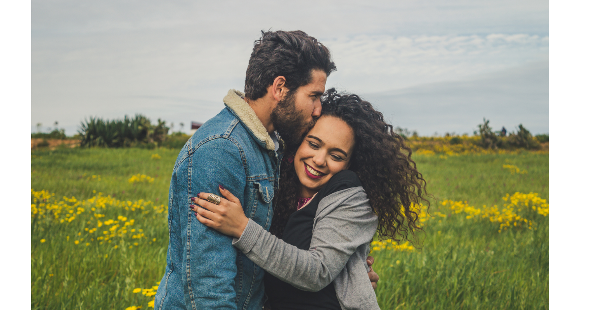 couple face to face smiling and laughing