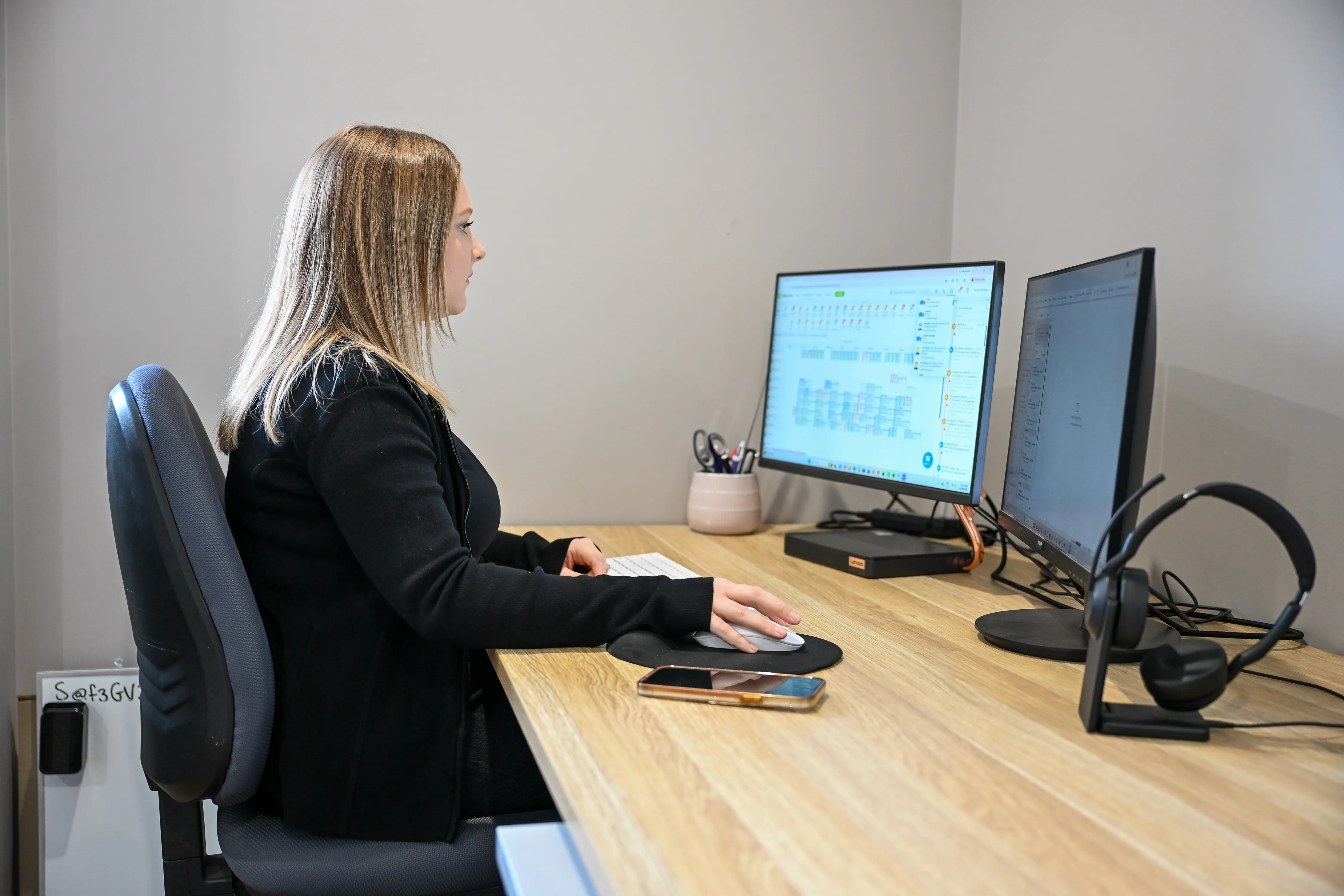 Torrie from the HomeSafeGV admin team taking a booking at the Kialla office