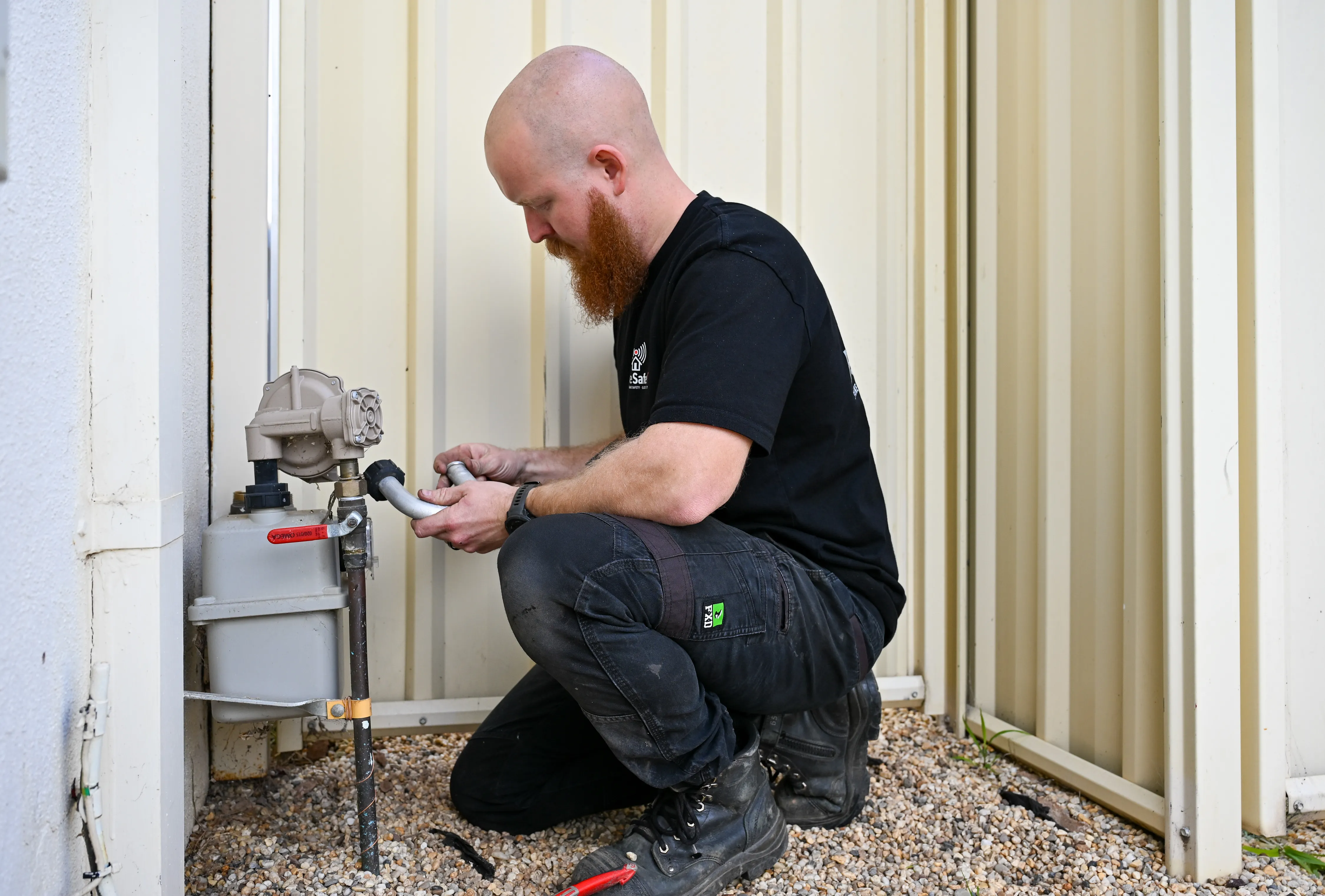 Tom, Gas Safety Manager at HomeSafeGV, servicing a gas meter during a safety check