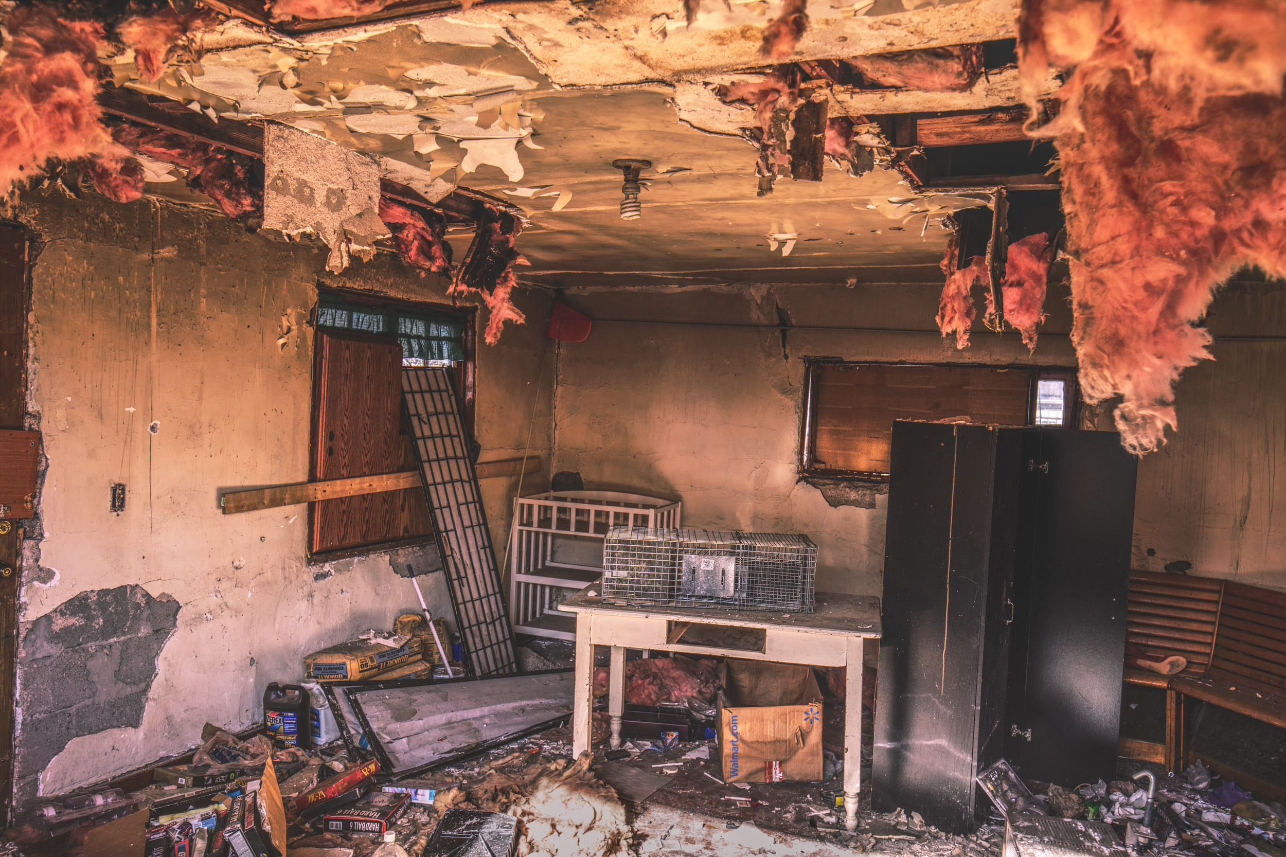 Fire-damaged room interior requiring contents removal and cleaning