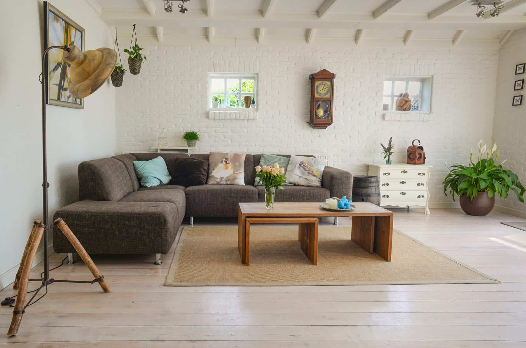Living room with drapery, tiled flooring and a wooden centre table