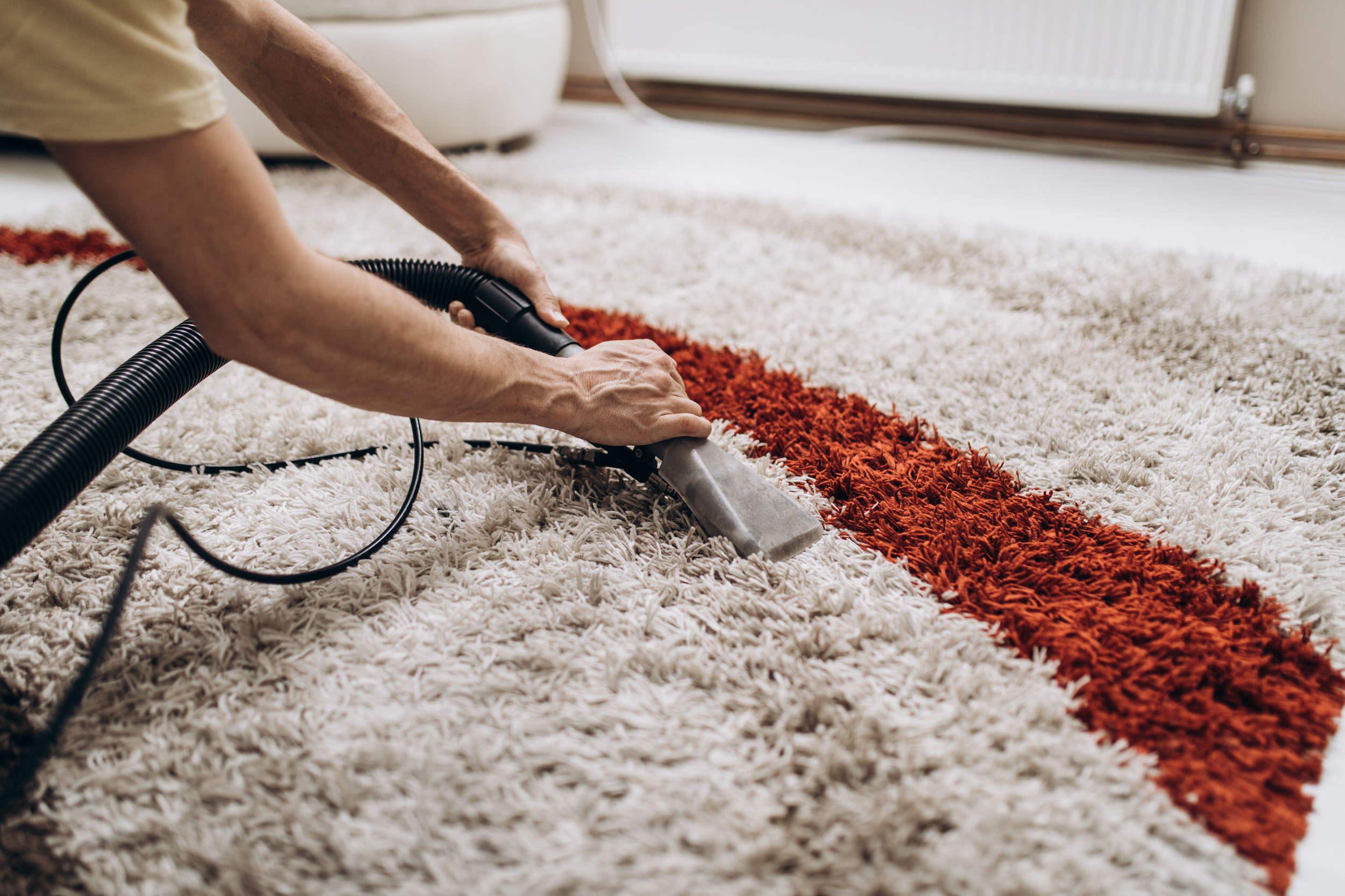 Deep cleaning an area rug to lift embedded dirt