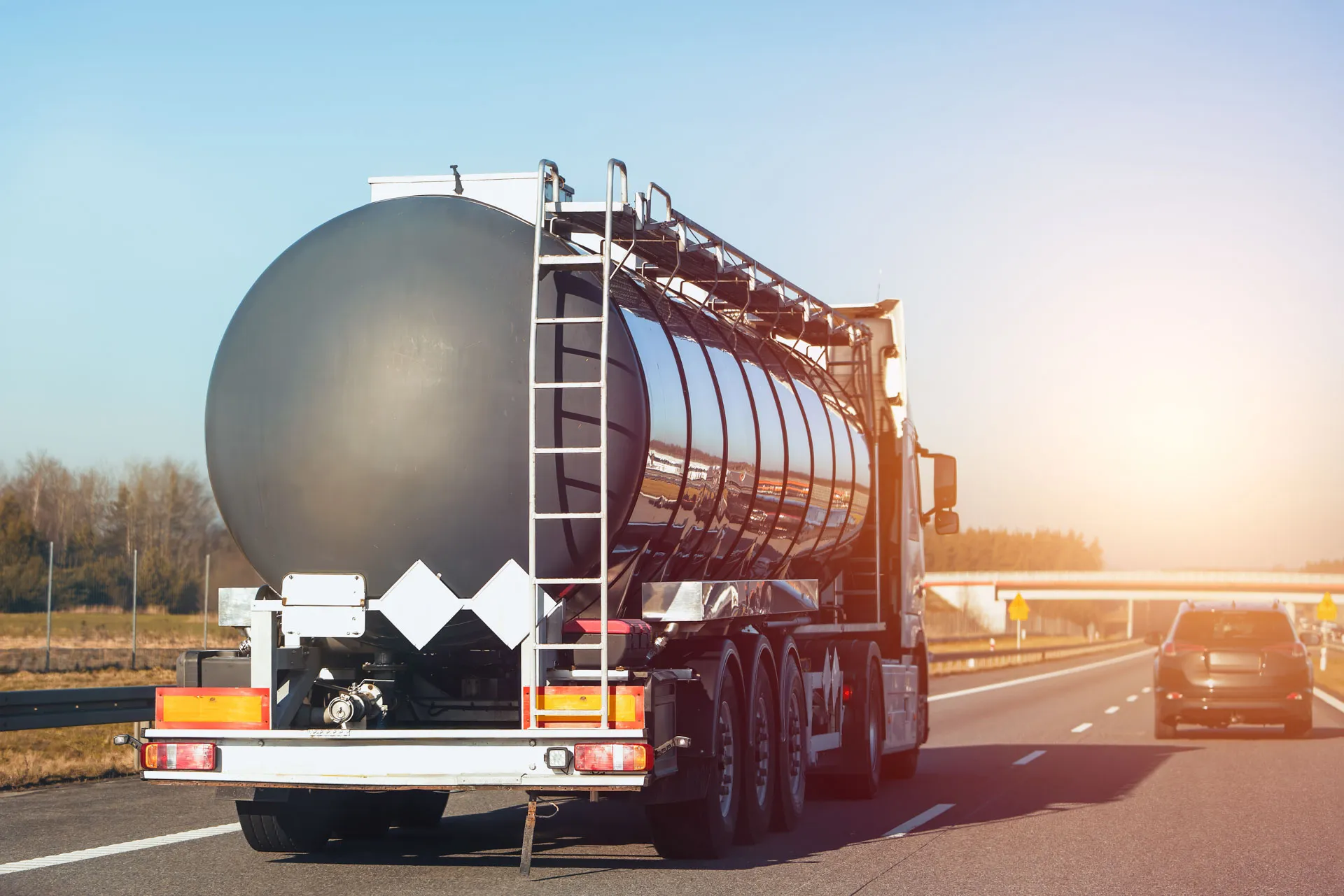 Fuel tanker travelling a regional highway at dusk