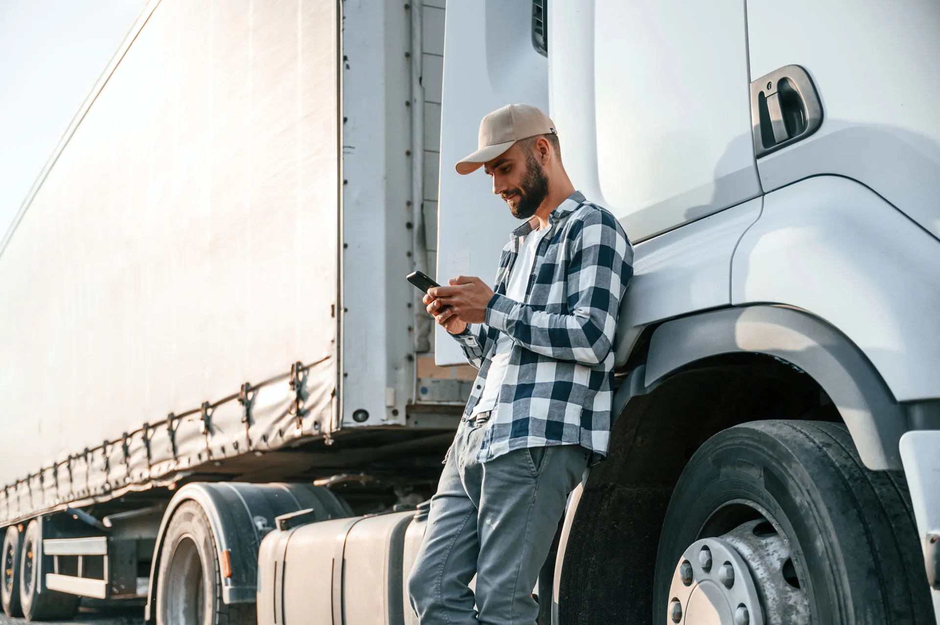 Owner-driver beside his truck