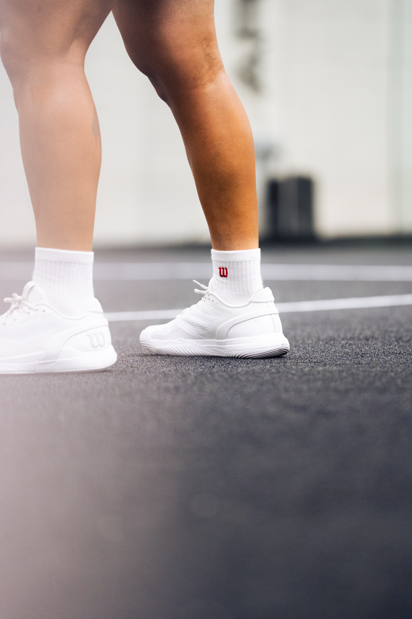 Footwork detail on the padel court