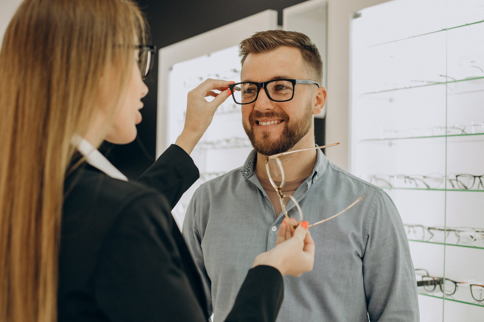 Optician fitting eyeglasses at Slickrock Vision Center