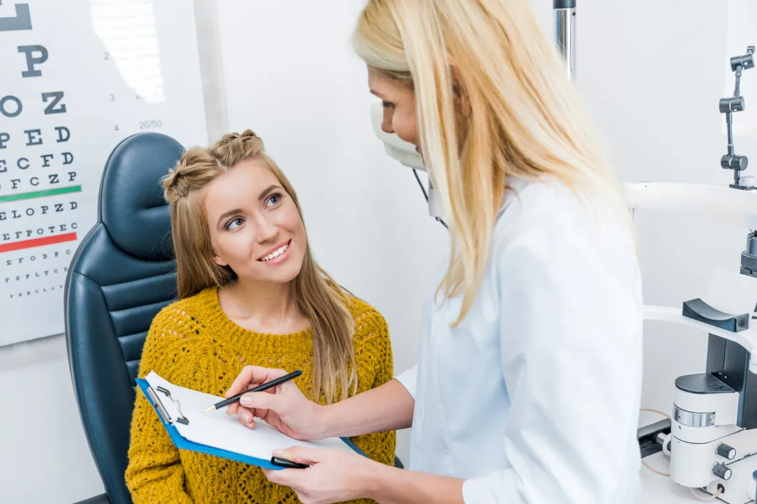 happy female patient smiling at the doctor