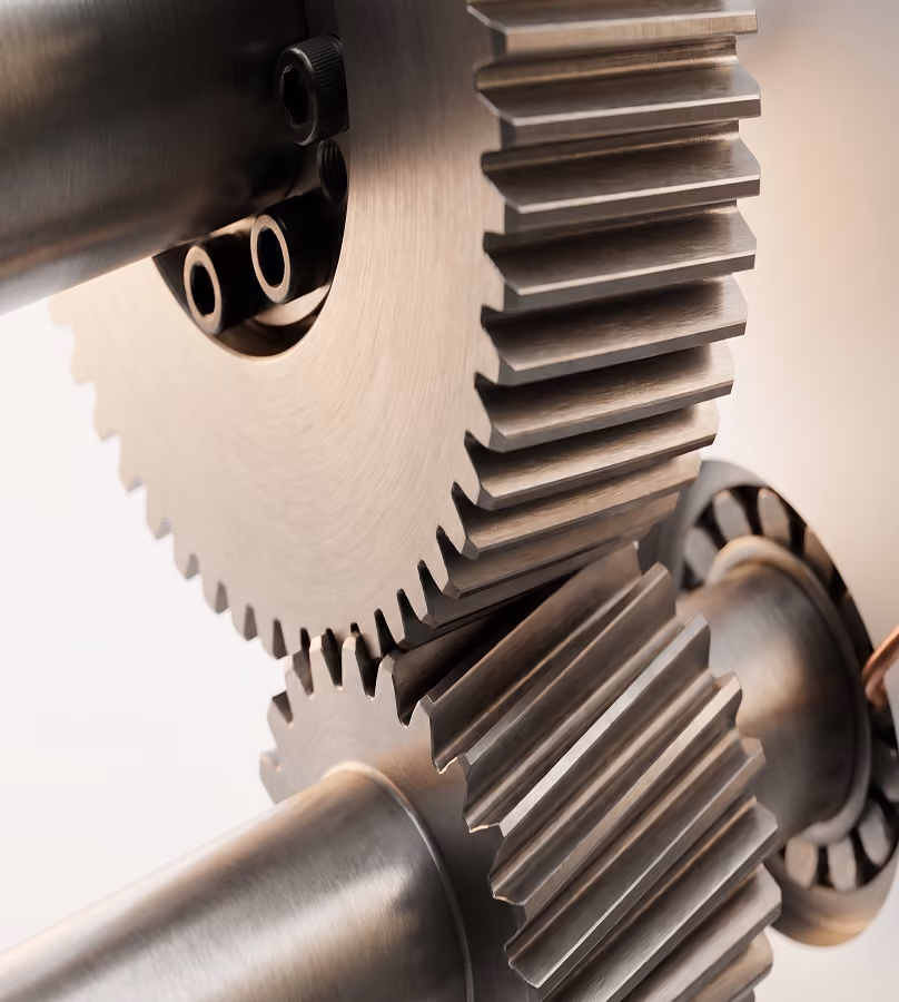 Close-up of two interlocking metal gears with detailed teeth and smooth cylindrical shafts, showcasing mechanical engineering components.