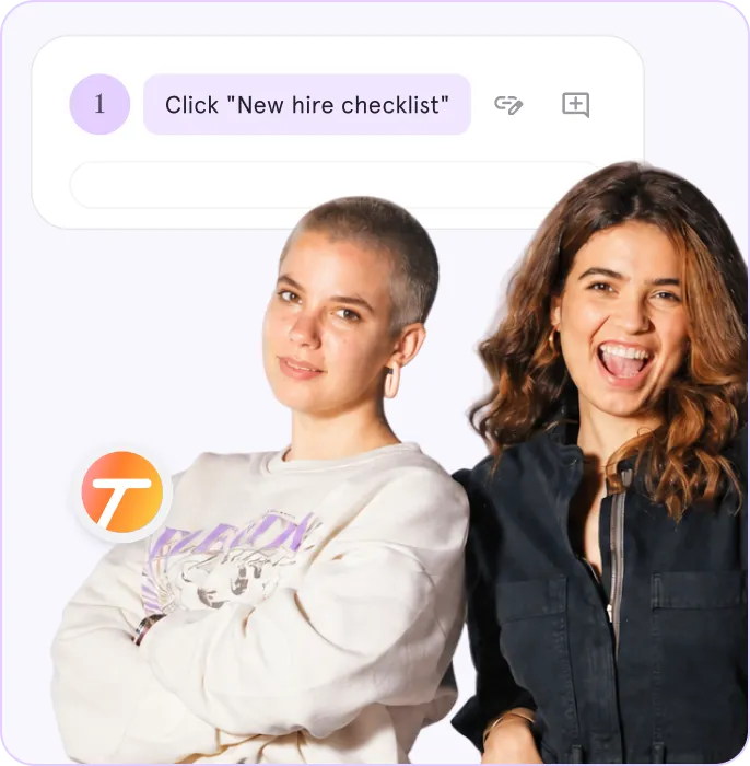 Two smiling women, one with short hair and white sweatshirt, the other with long hair and black jacket.
