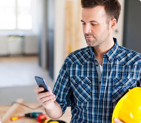 Construction worker using a phone