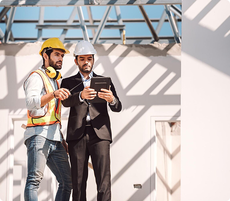 Construction workers reviewing plans