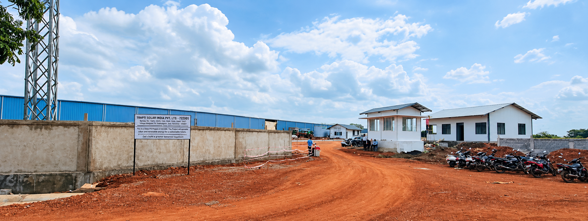 The Telangana site during initial construction, with the plant shed, administrative block, and site office visible.