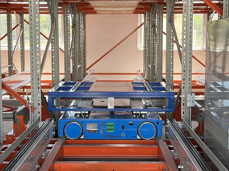 Autonomous mobile robot (AMR) pallet shuttle in warehouse racking