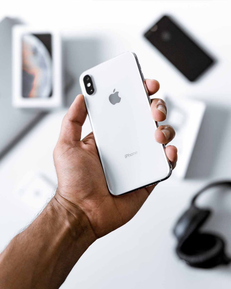 Man holding unboxing an iphone