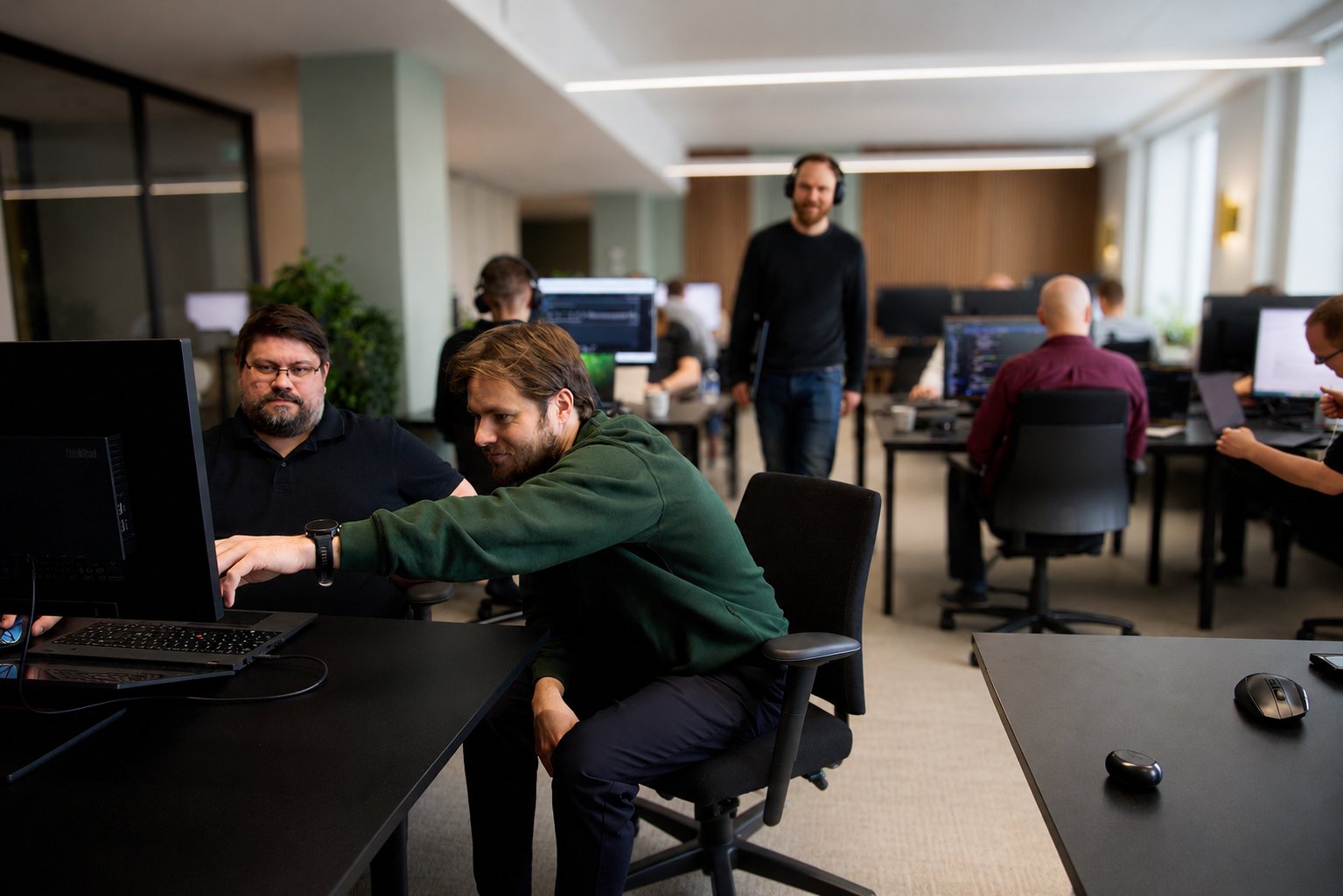 Brightly engineers working together at the office