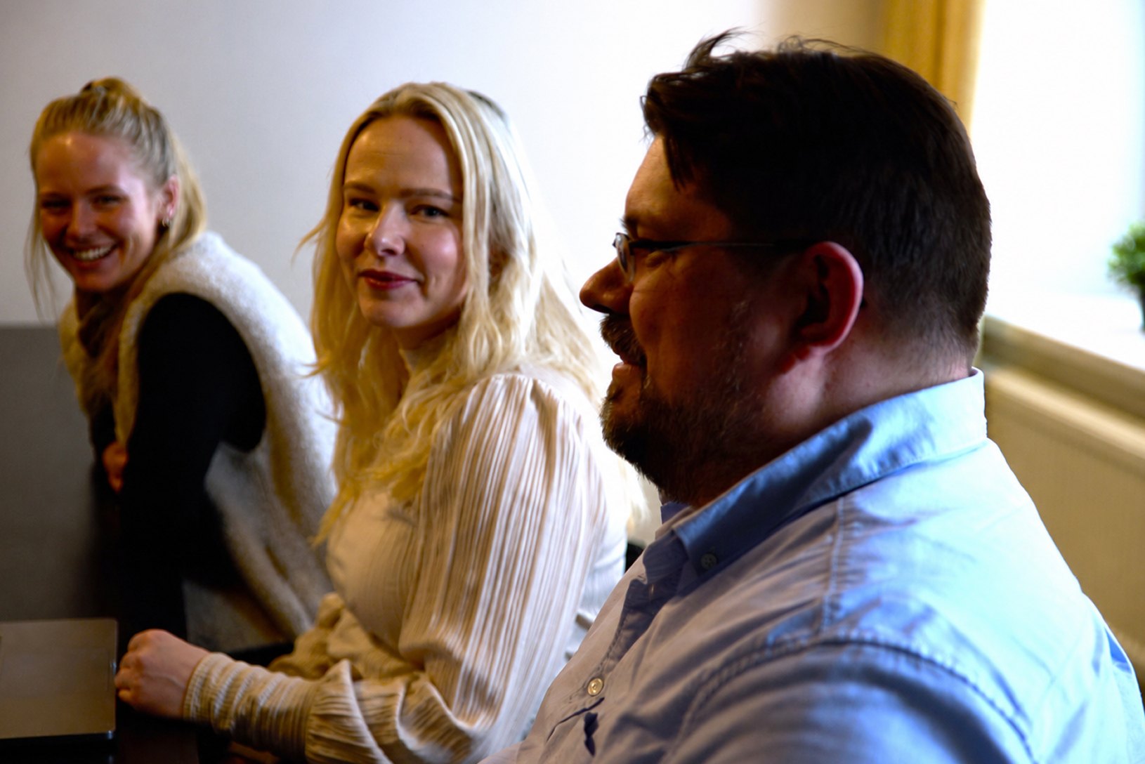Three colleagues talking in a meeting