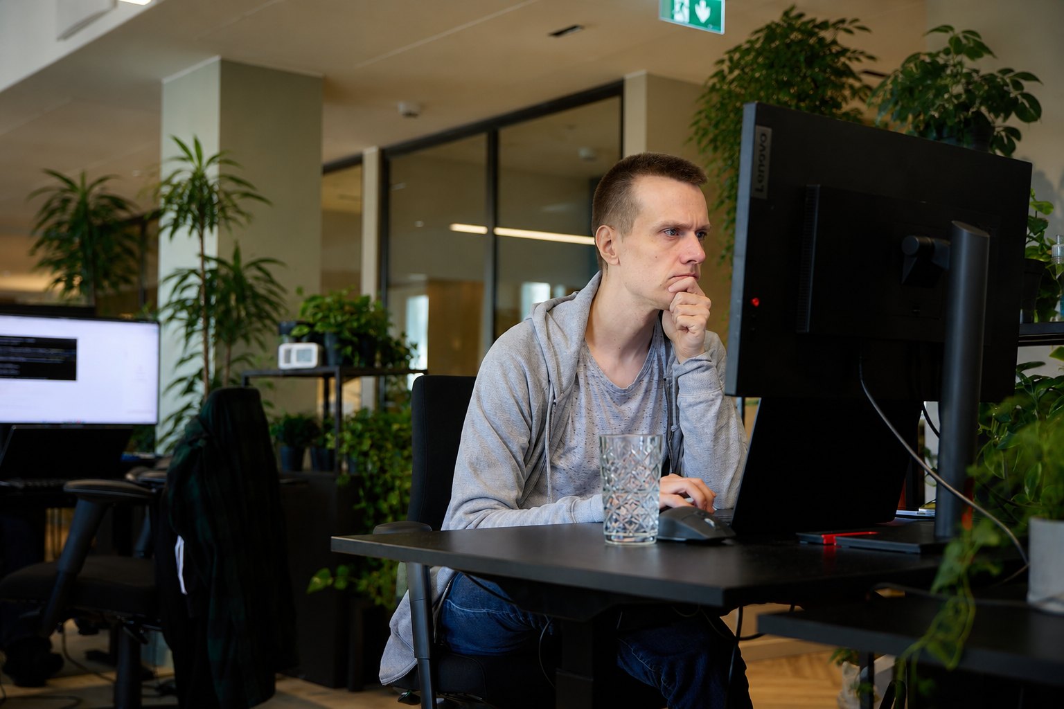 Engineer thinking at a workstation