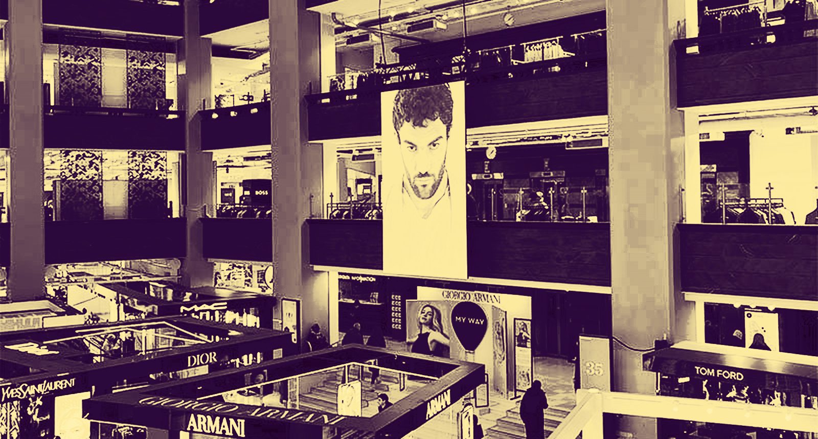 Shoppers in a multi-storey department store atrium
