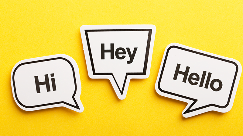 Three cartoon speech bubbles with “Hi”, “Hey”, and “Hello” inside them against a yellow background.