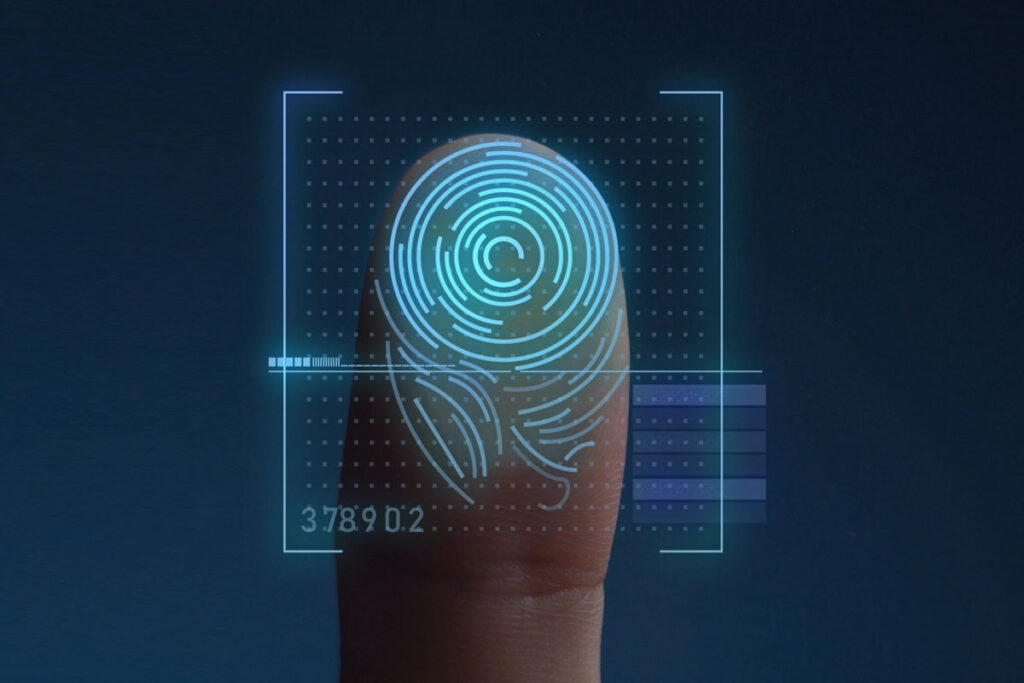 An image of a finger pressed against glass and being analyzed to identify the person.