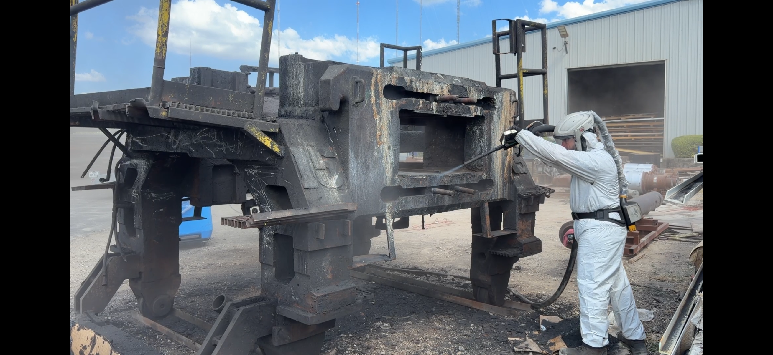 Dry ice blasting an injection mold cavity in the press