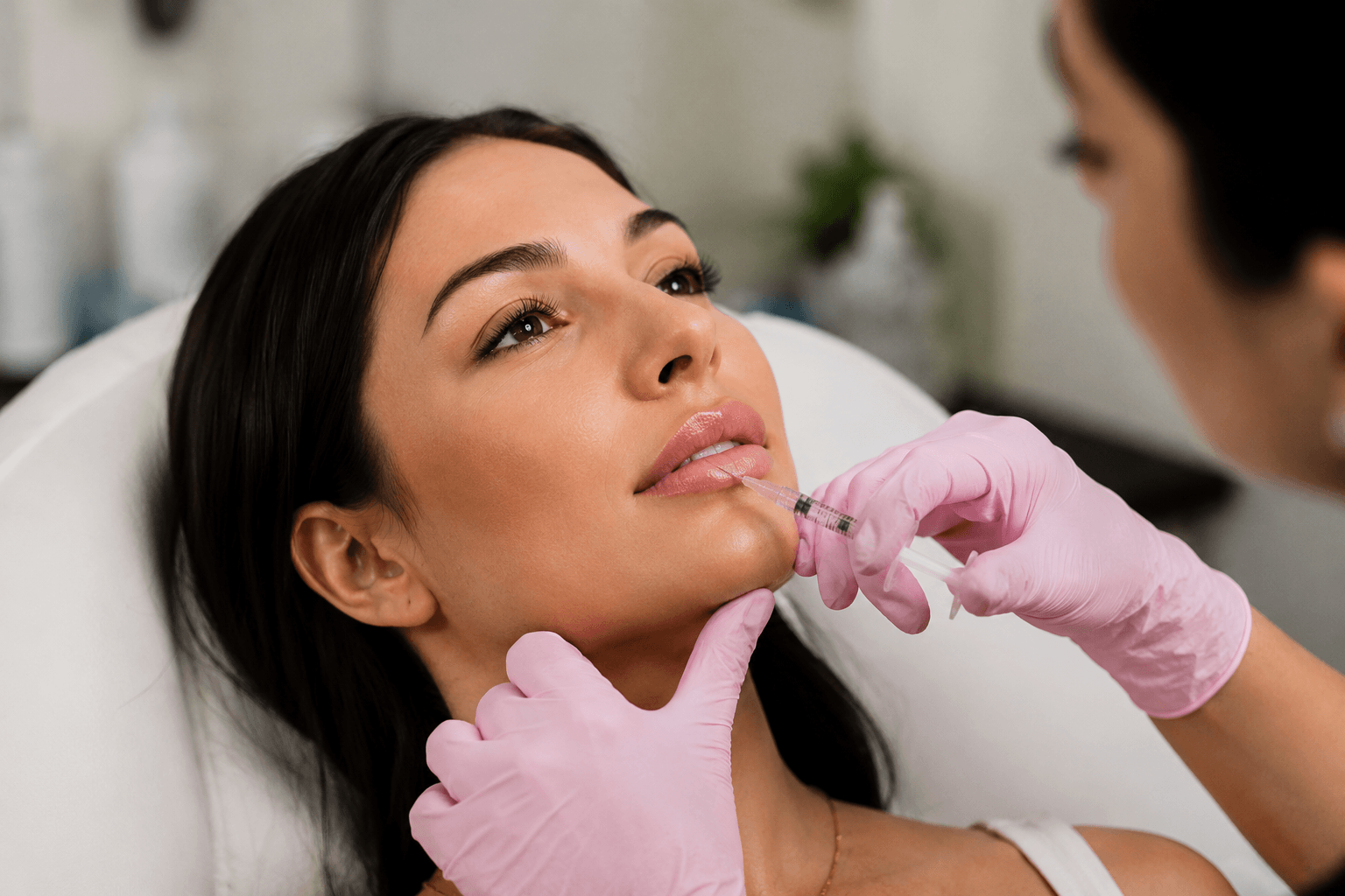 Woman receiving lip filler treatment in a Tampa, Florida aesthetic clinic for natural-looking lip enhancement results