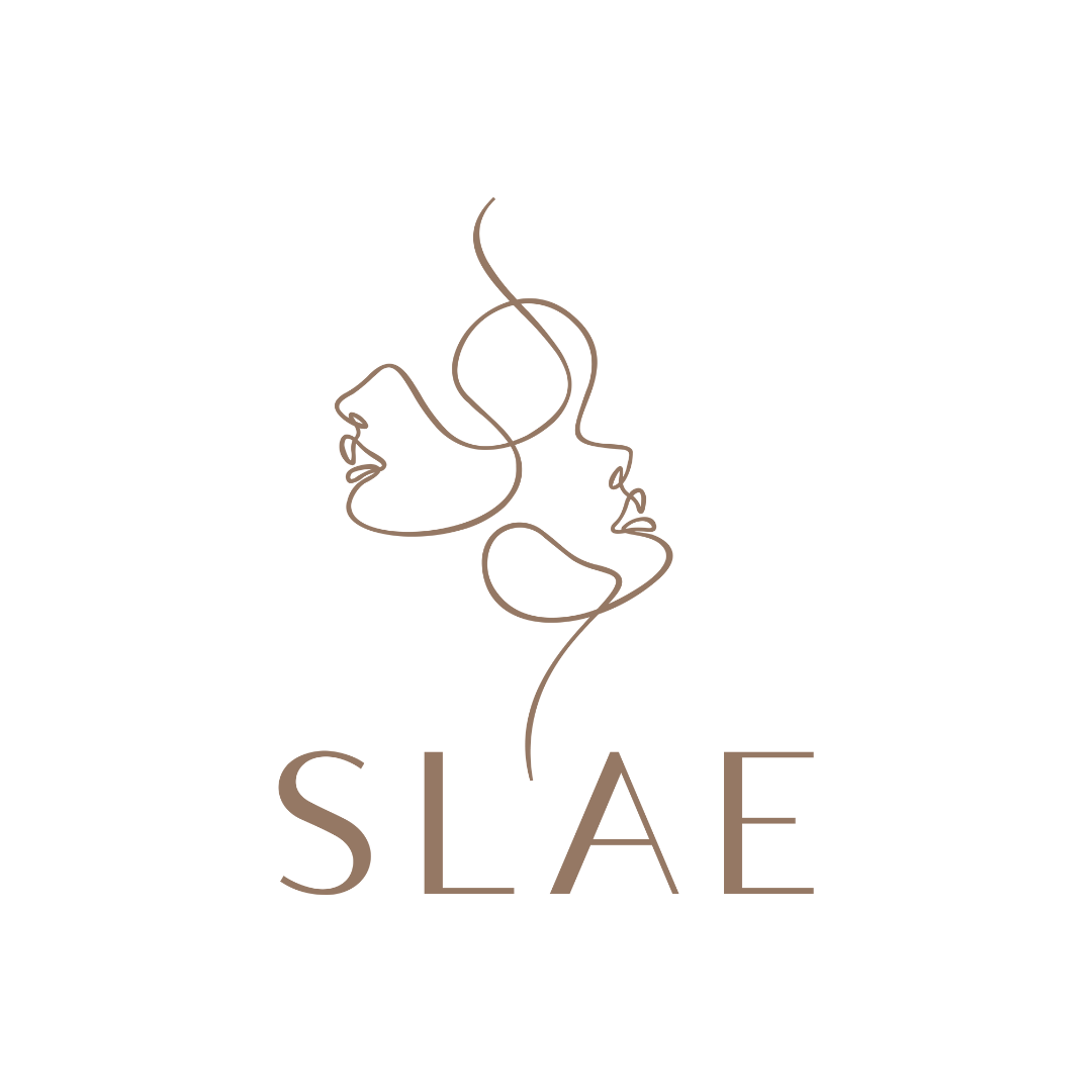 Minimalist line art of two intertwined female faces above the word SLAE in brown font.