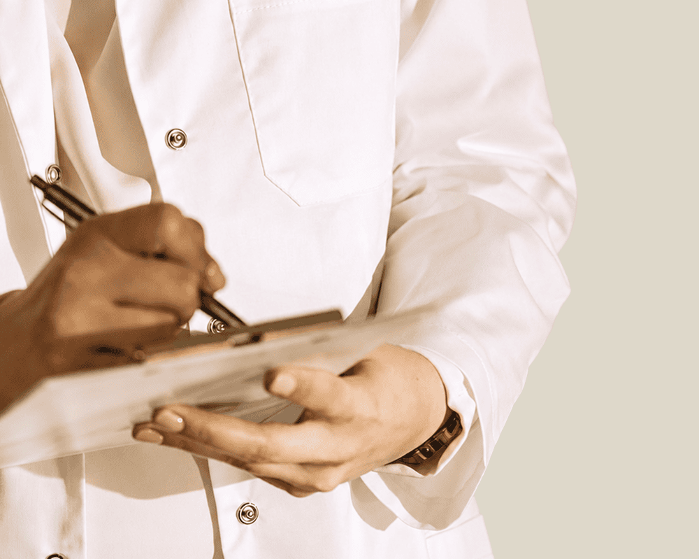 Healthcare professional taking notes