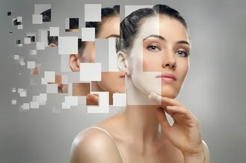 Portrait of a woman with digital pixelated squares effect on her face and head.
