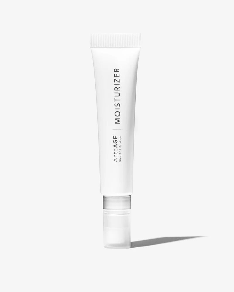 White tube of AnteAGE Moisturizer standing upright casting a shadow on white background.