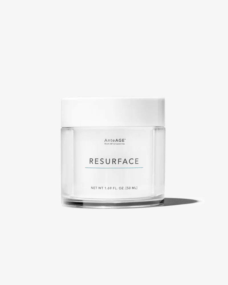 Clear jar of AnteAGE RESURFACE skincare cream with white lid on white background.