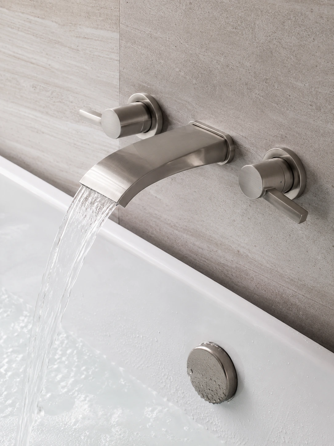 Freestanding tub filler beside a bathtub