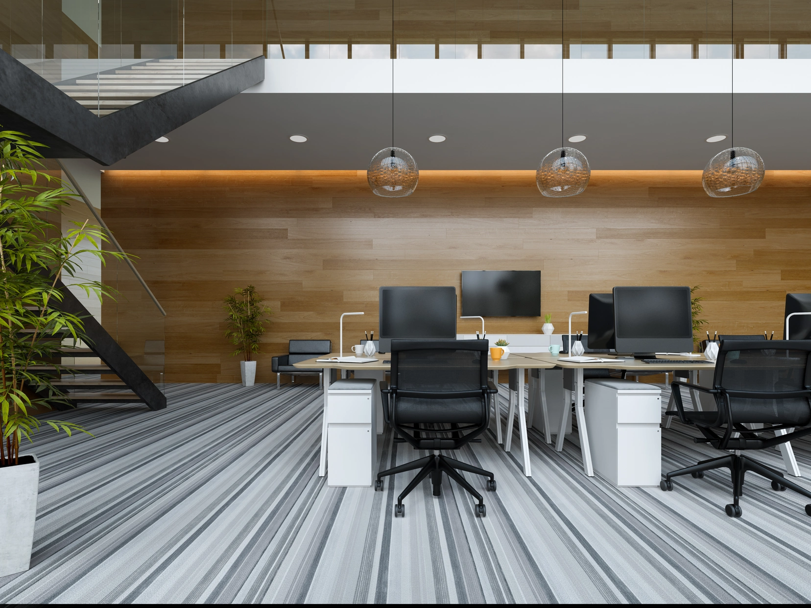 Grey striped carpet tiles in an open-plan office with workstations