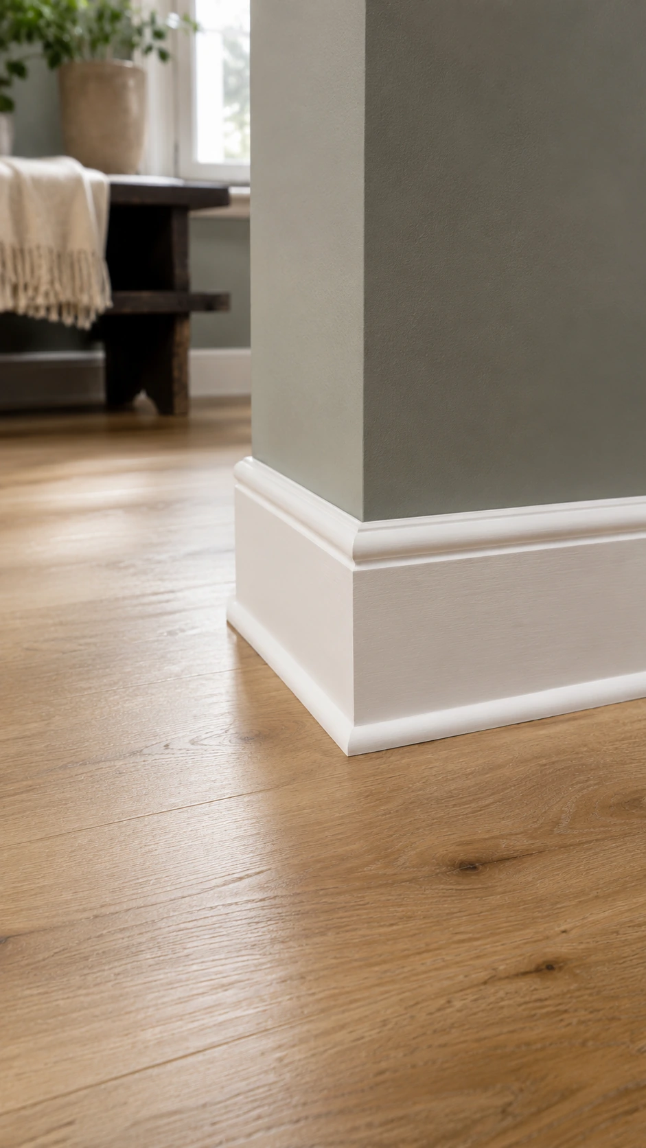 Quarter round trim where wood flooring meets a painted wall