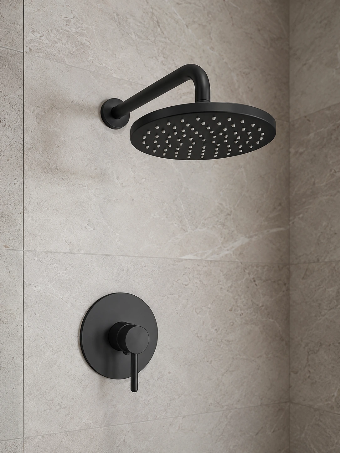 Matte black shower trim kit with a rain head and round control