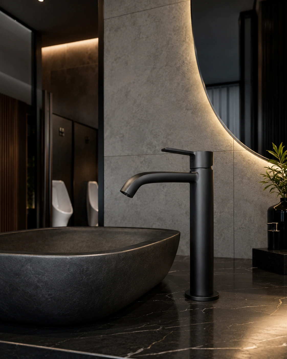 Matte black single handle faucet on a dark stone vessel basin